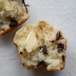 open chocolate chip muffin with butter