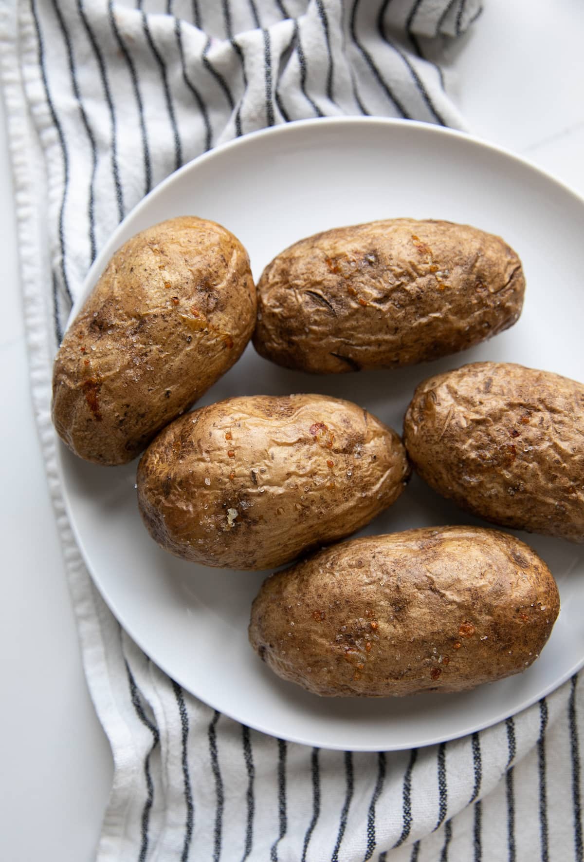 air fryer baked potatoes on plate