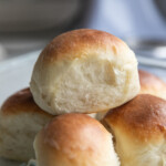 Dinner rolls stacked on a plate
