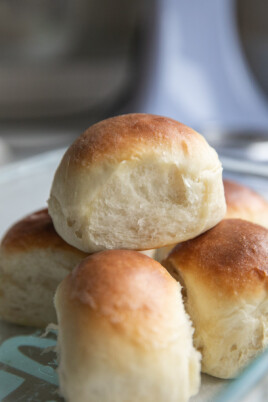 Dinner rolls stacked on a plate