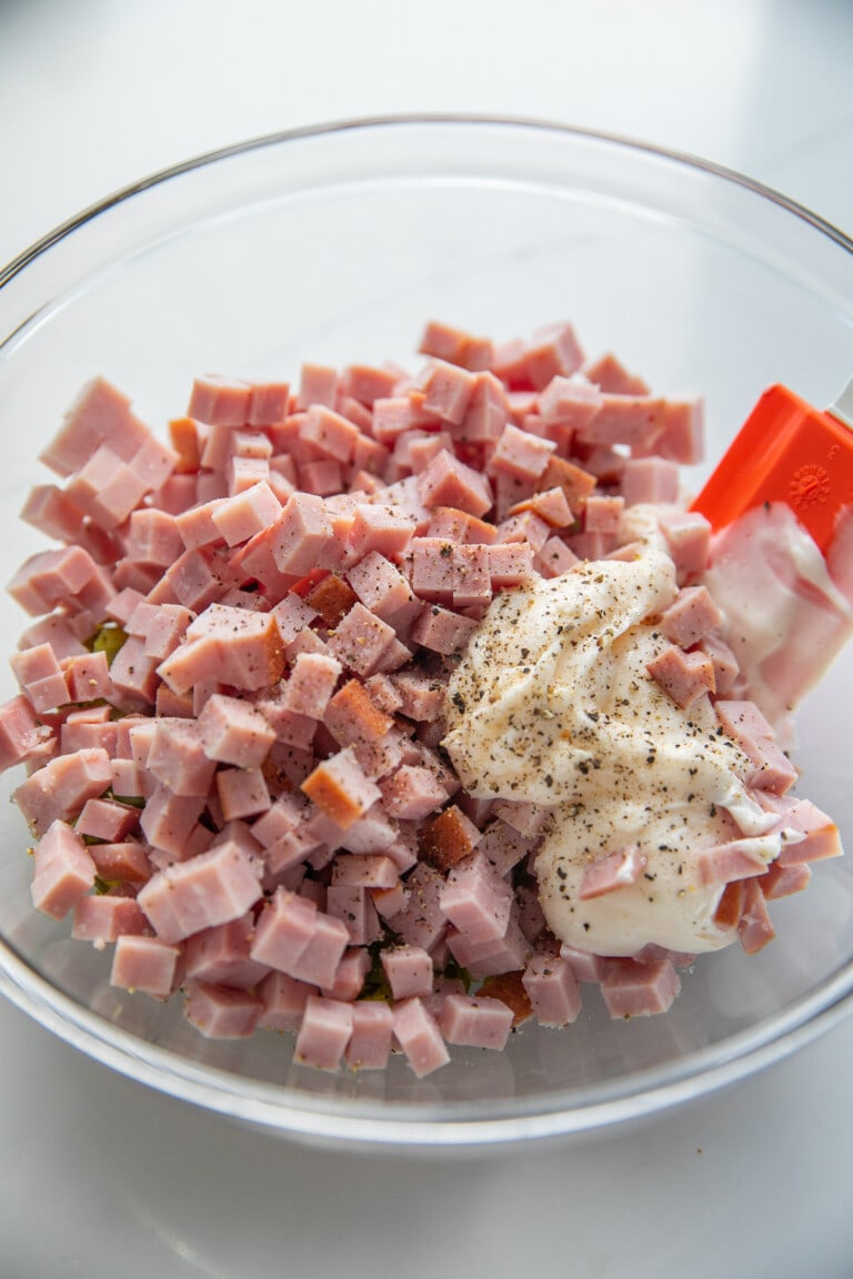 diced ham and mayonnaise in bowl with pepper