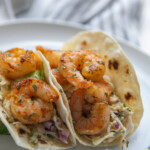 two shrimp tacos on plate
