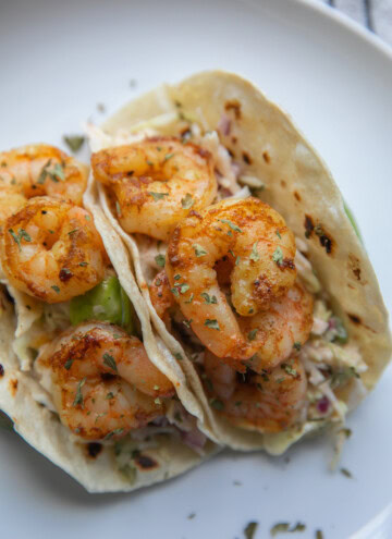 two shrimp tacos on plate