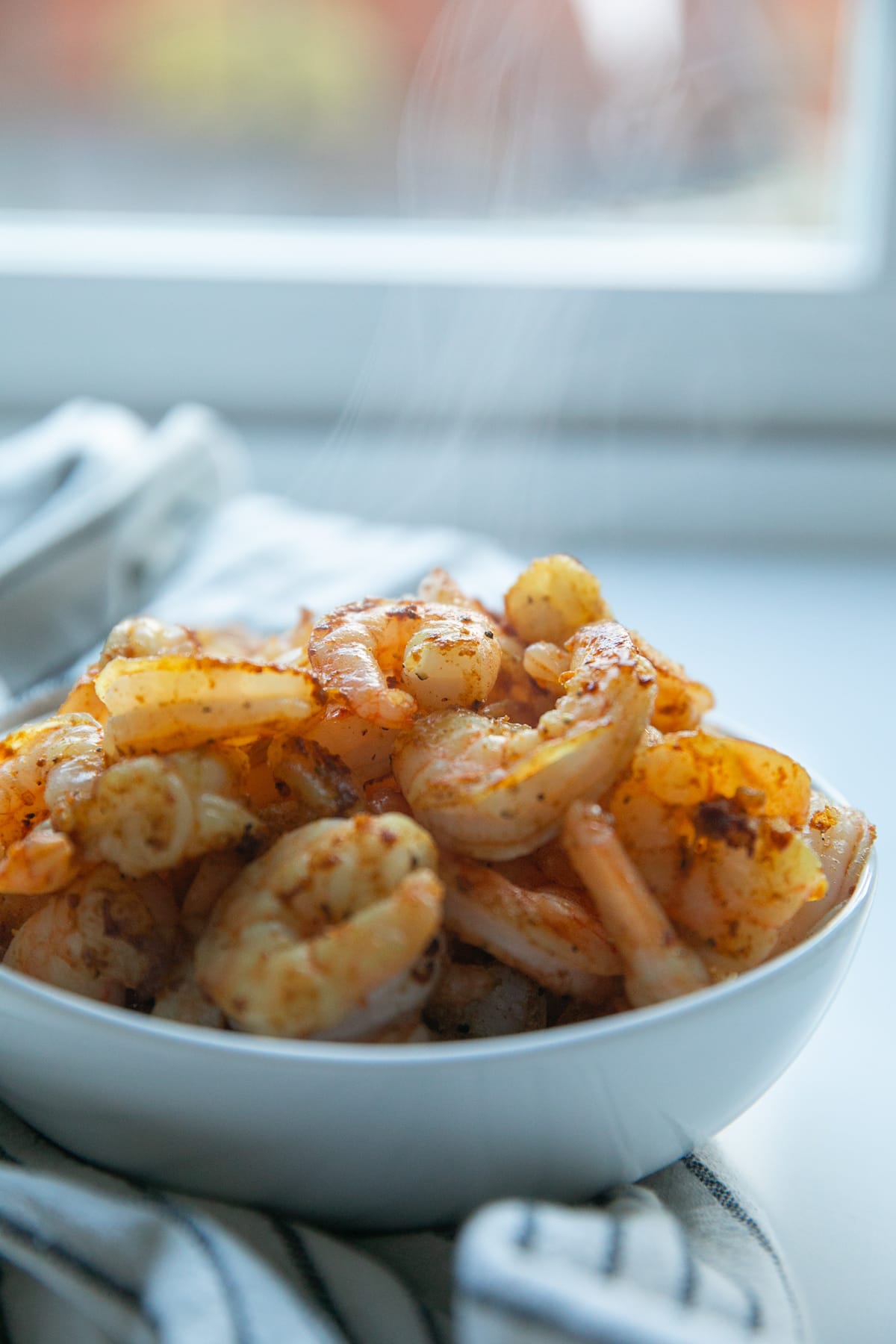 cooked taco shrimp in bowl with steam