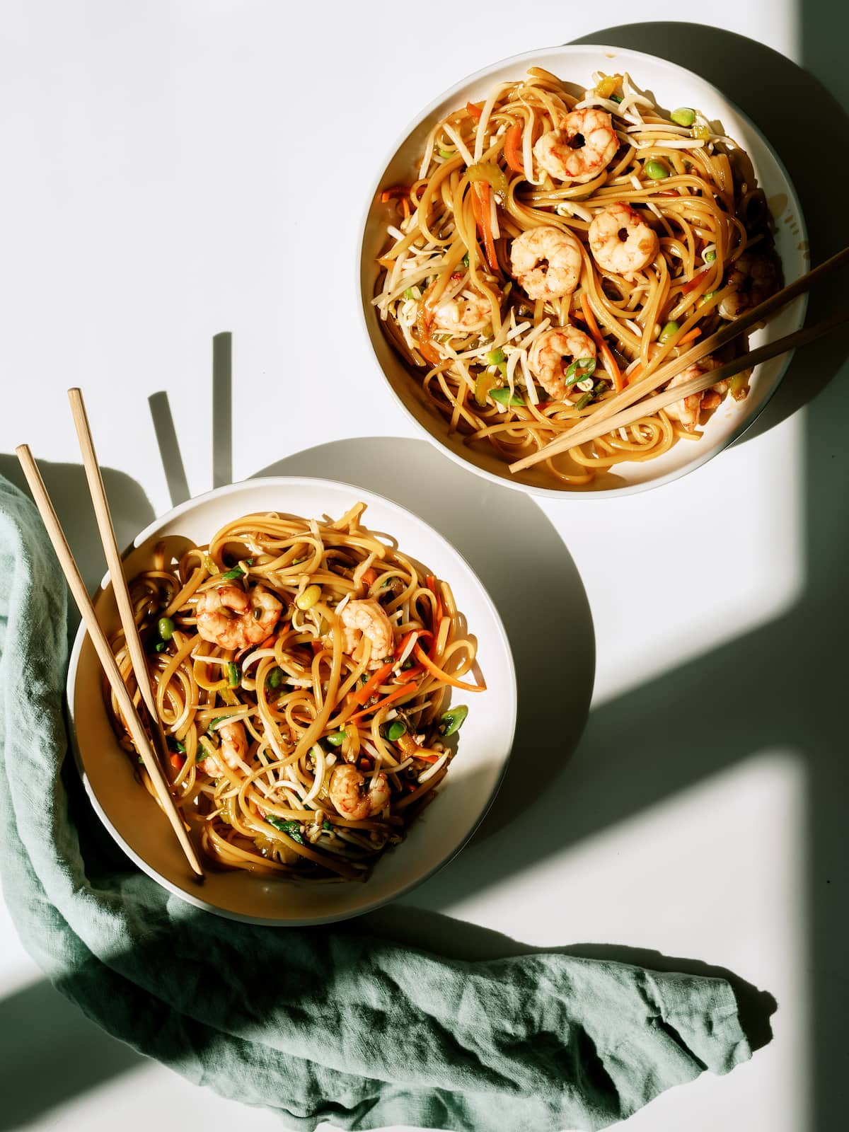 two bowls of soba noodles with shrimp