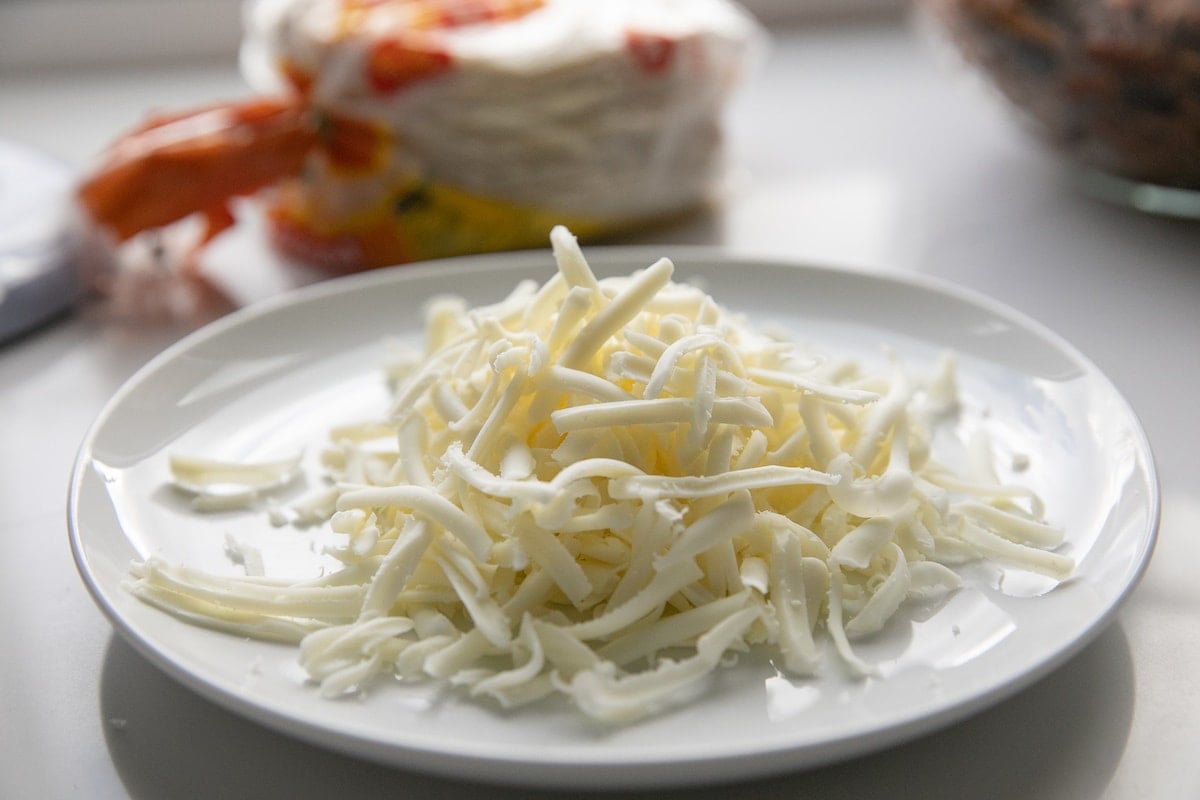 grated oaxaca cheese on plate