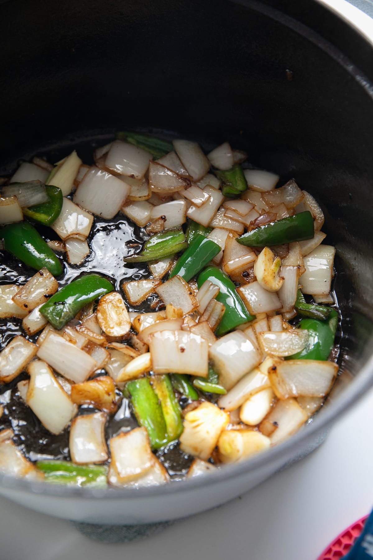 cooking onions, garlic and jalapenos in pot