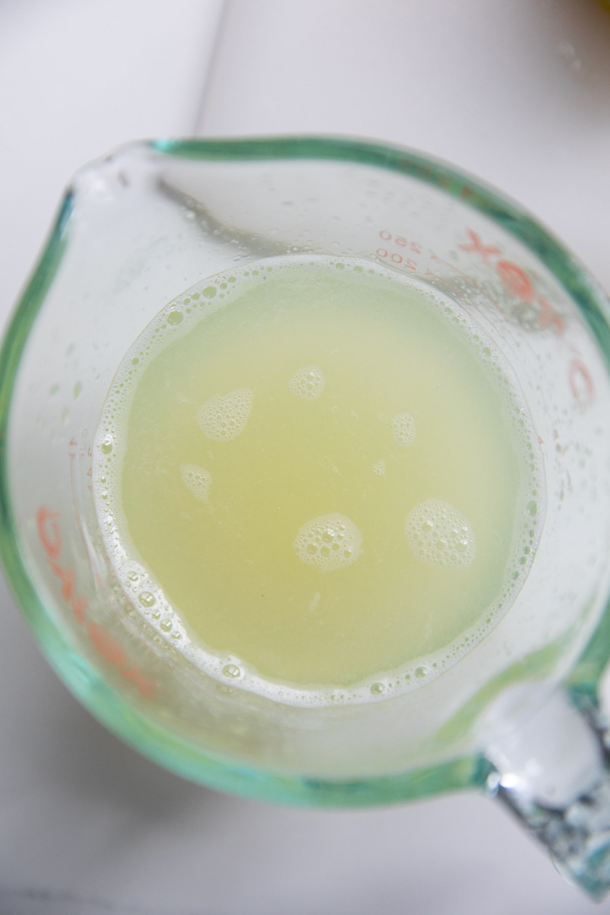 lemon juice in liquid measuring cup
