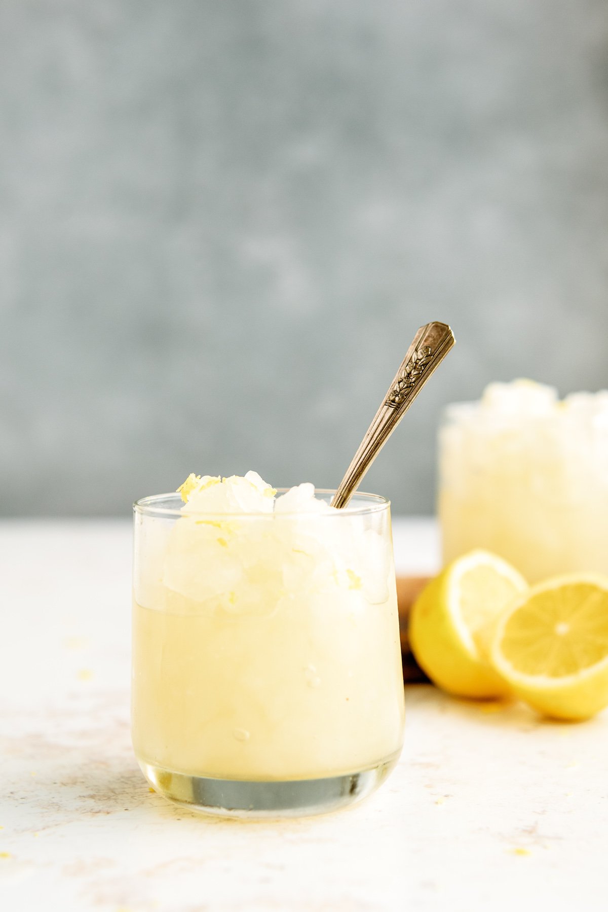 glass of frozen lemonade with spoon