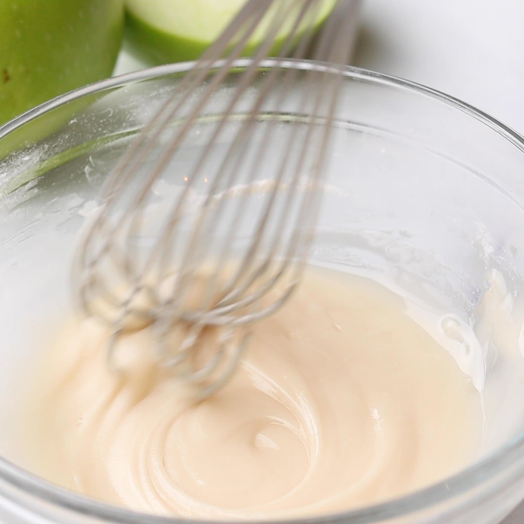 Apple Turnover icing in bowl with whisk