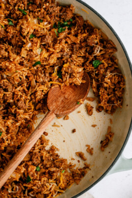 taco rice in pot with wooden spoon