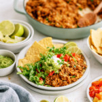taco rice on plate with chips and toppings