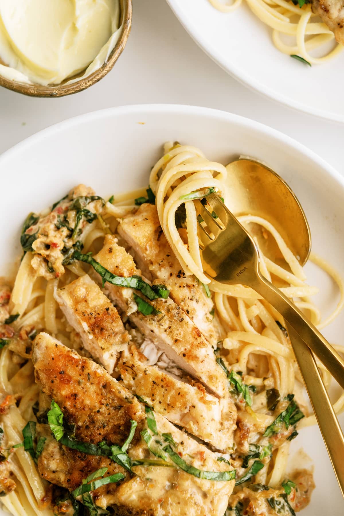 tuscan-chicken on plate with fork