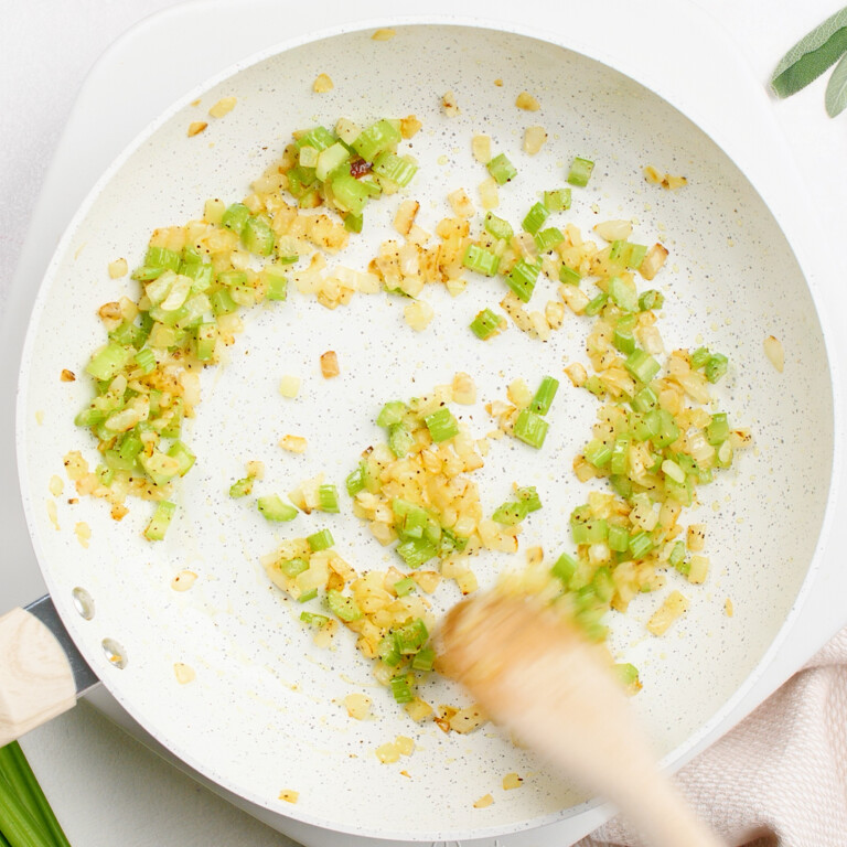 onion and celery in pan