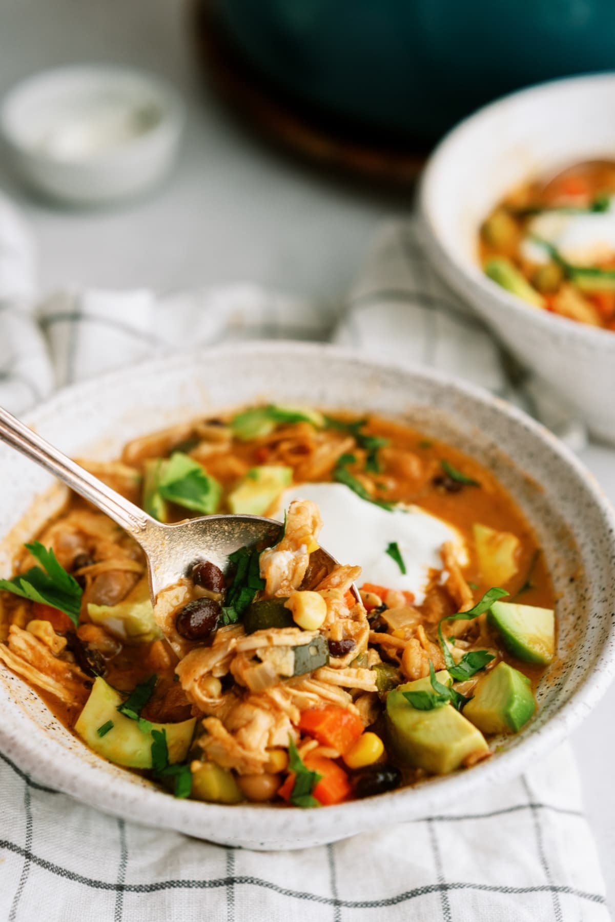 Bowl of chicken tortilla soup with spoon