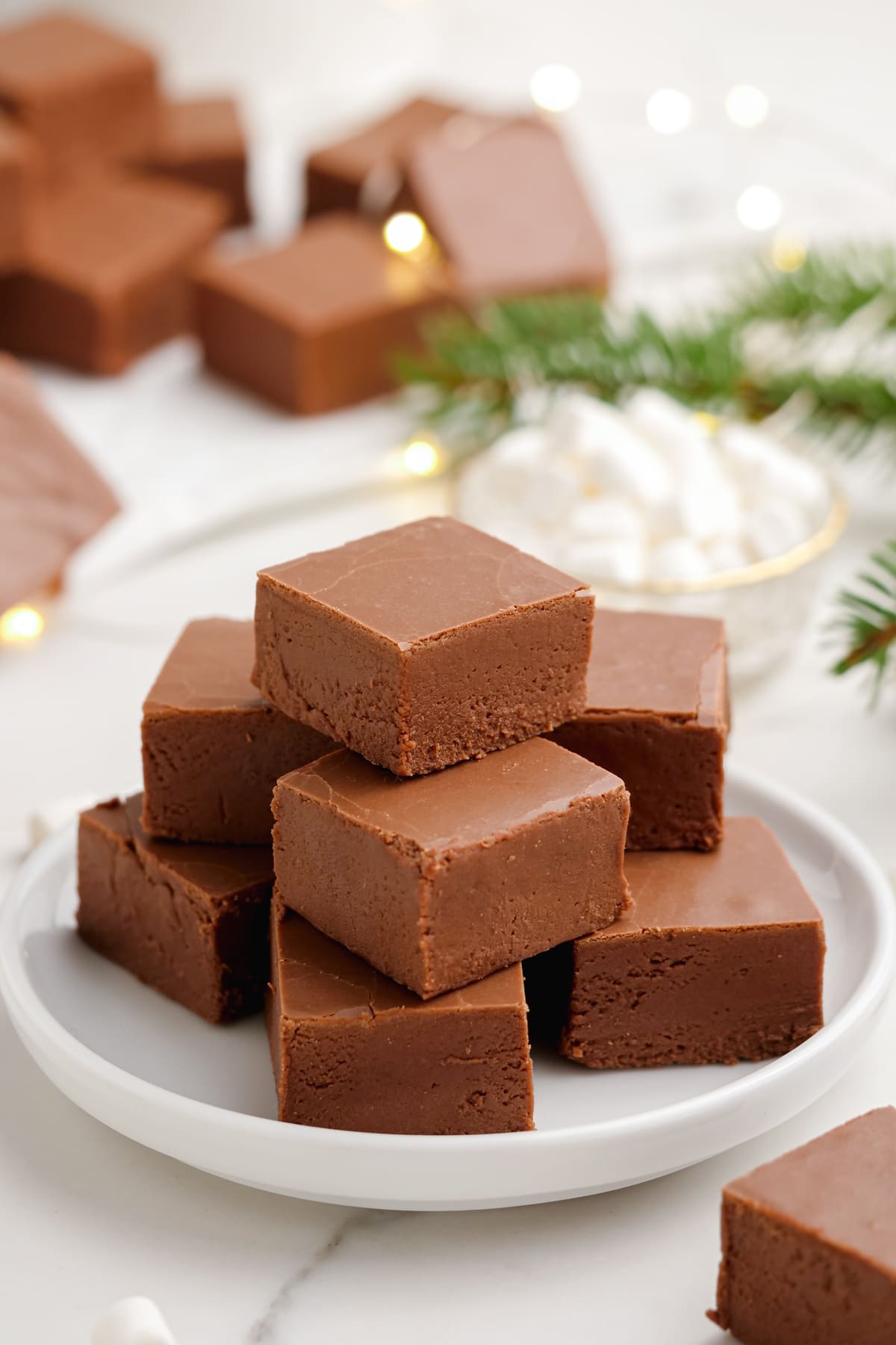 cubed fudge stacked high on a plate