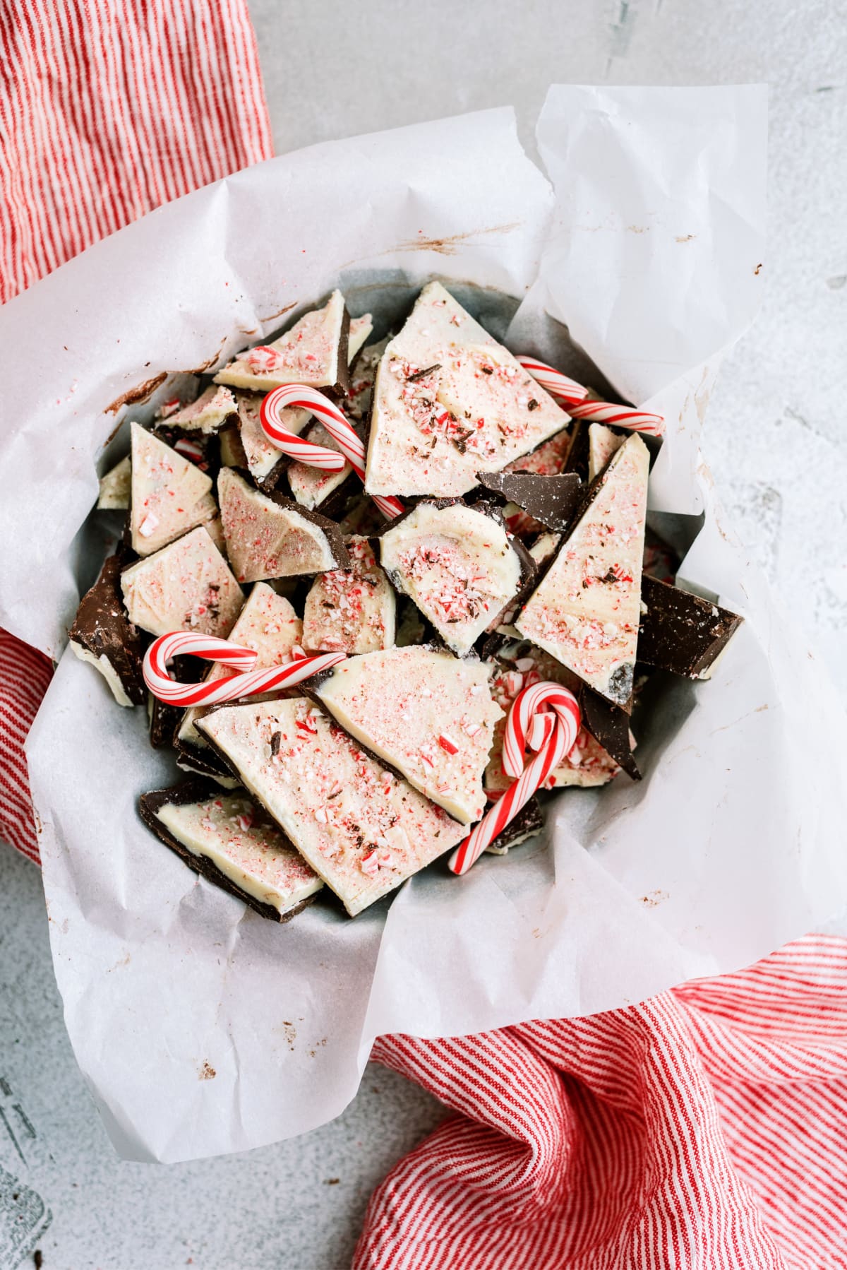 peppermint bark in bowl with candy canes