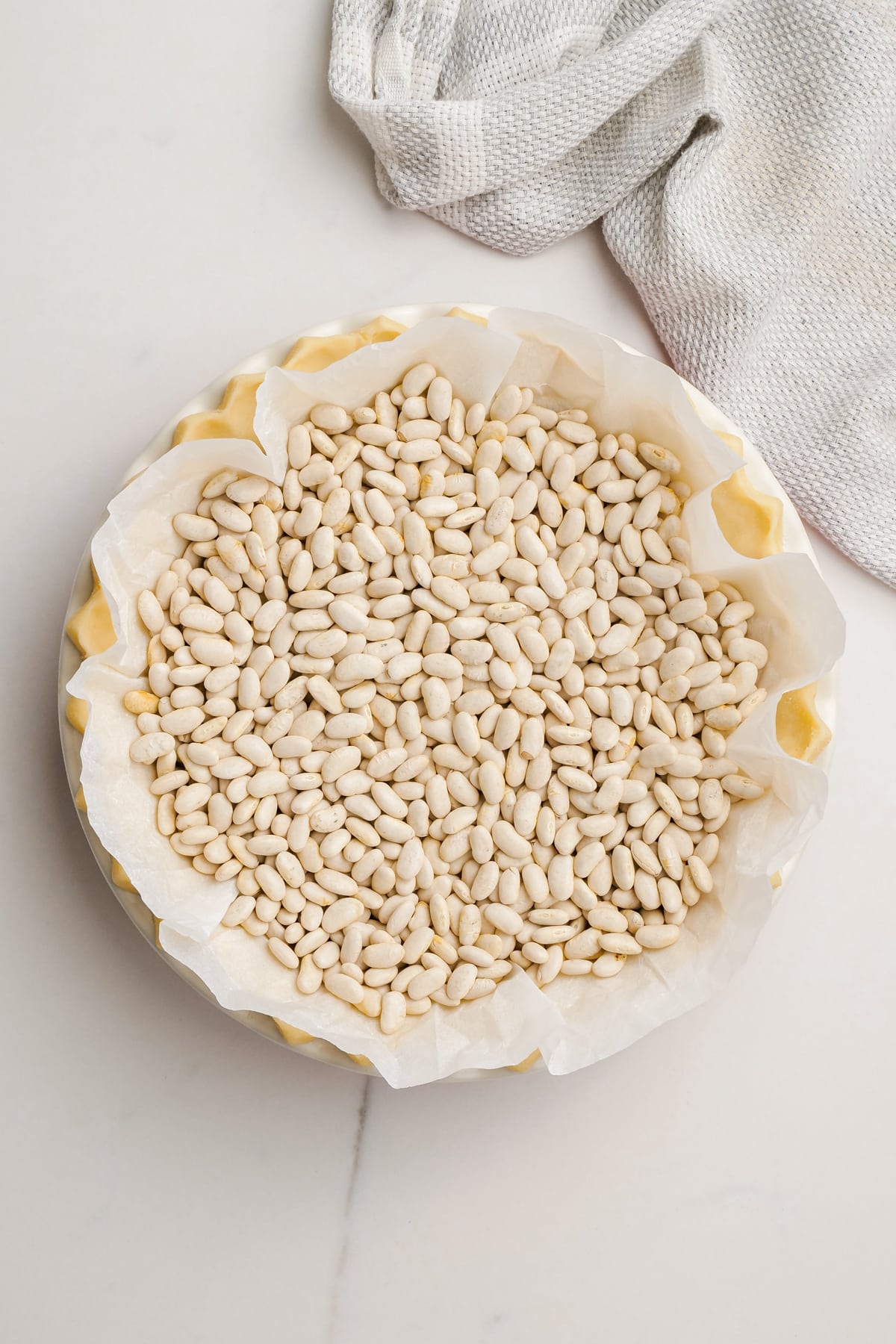 pie crust with beans to blind bake
