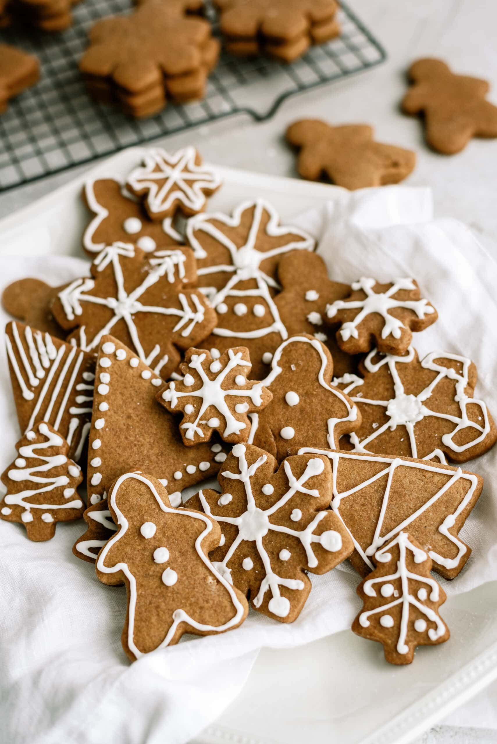 pile of frosted gingerbread cookie shapes