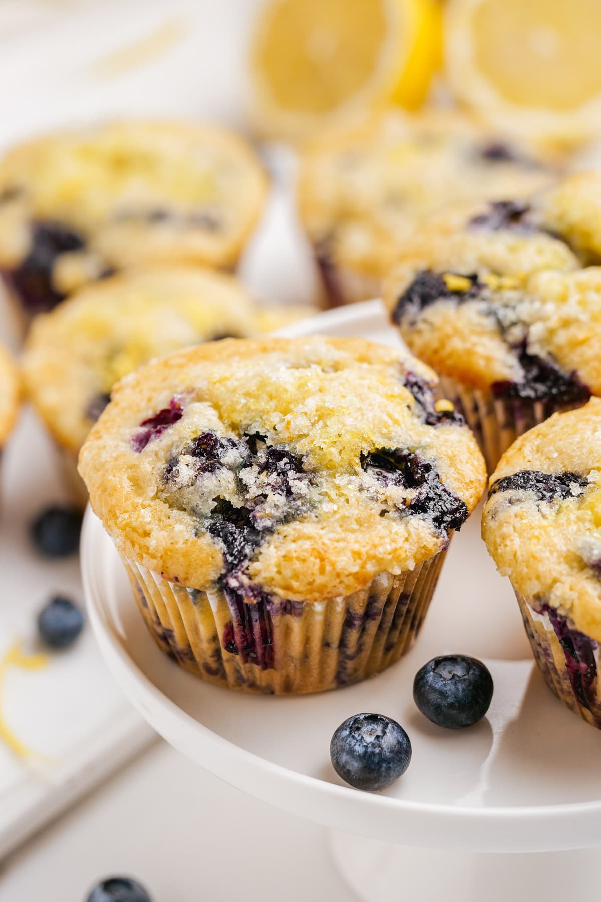 baked blueberry muffins on cake plate