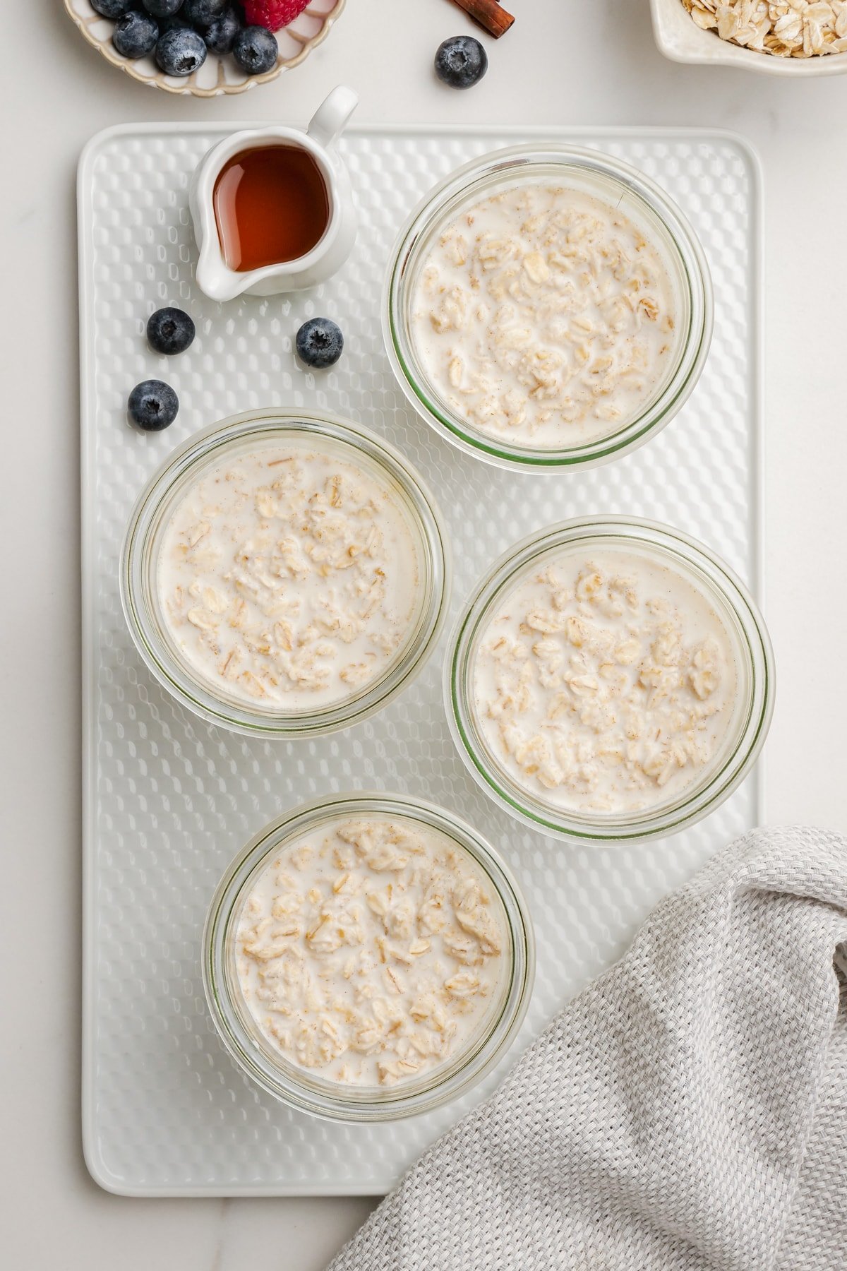individual overnight oats bowls on tray