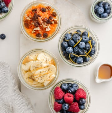 individual overnight oats jars on tray