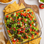 taco dip in casserole dish on tablescape