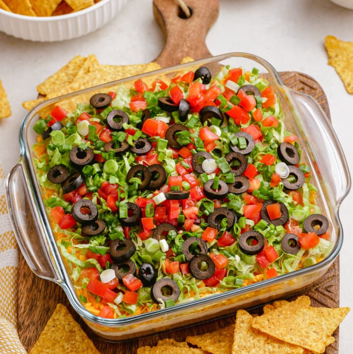 taco dip in casserole dish on tablescape