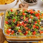 taco dip in casserole dish on tablescape