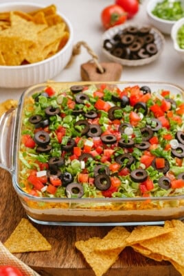 taco dip in casserole dish on tablescape