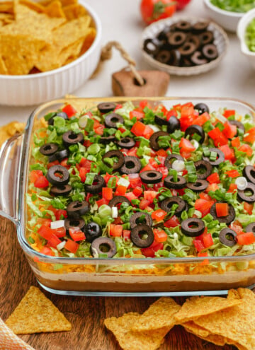 taco dip in casserole dish on tablescape