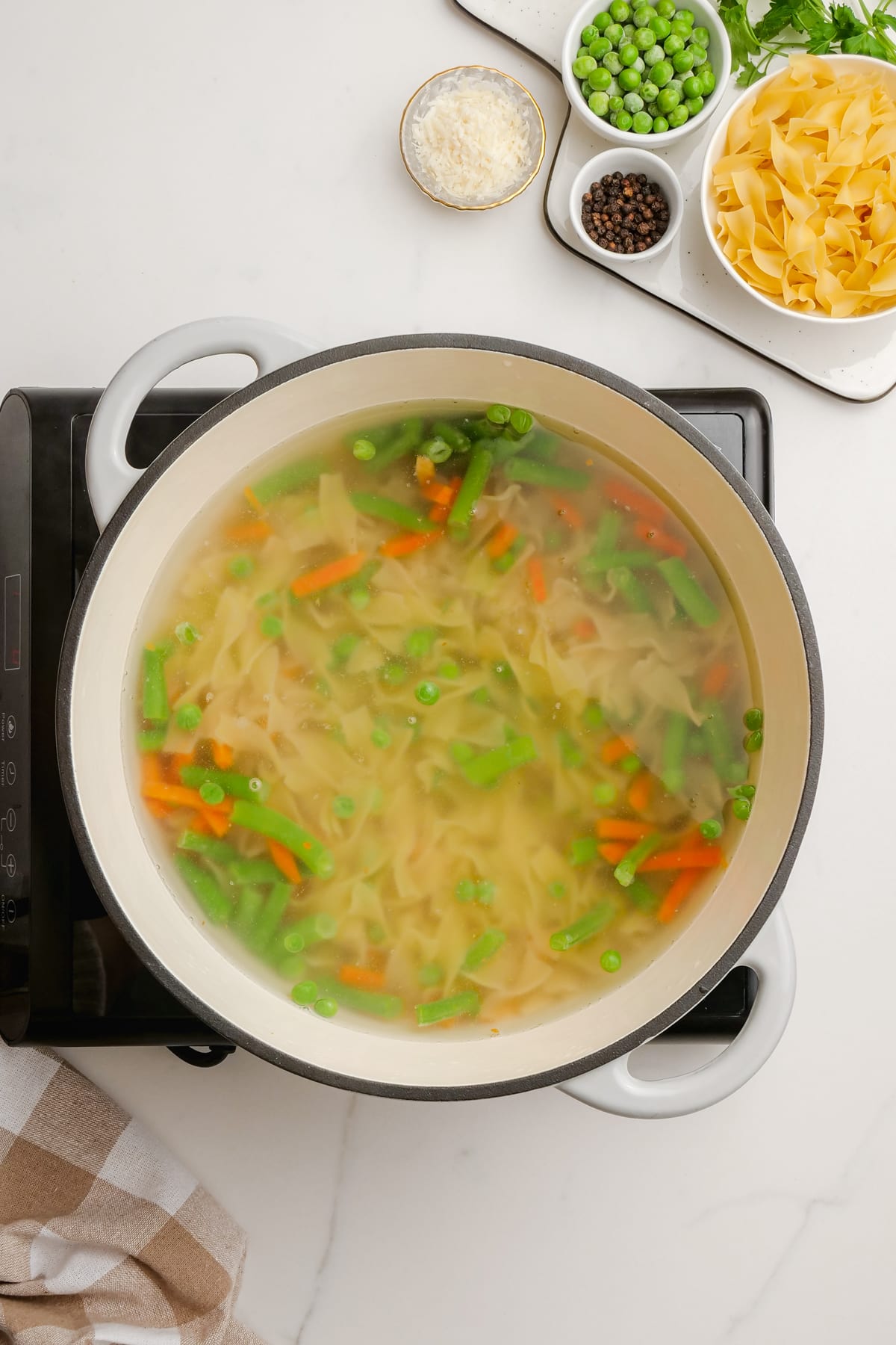 Tuna noodle casserole ingredients in pot