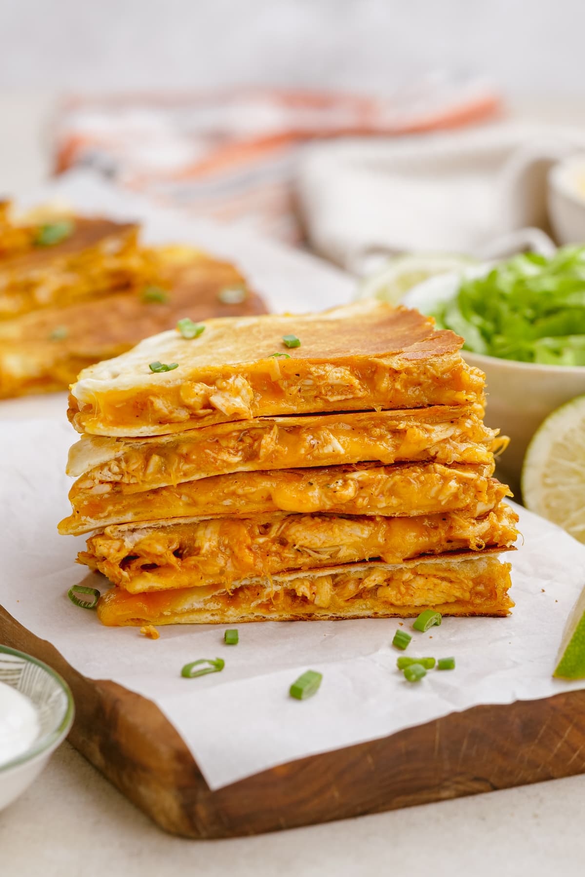 chicken quesadilla triangles stacked on a plate