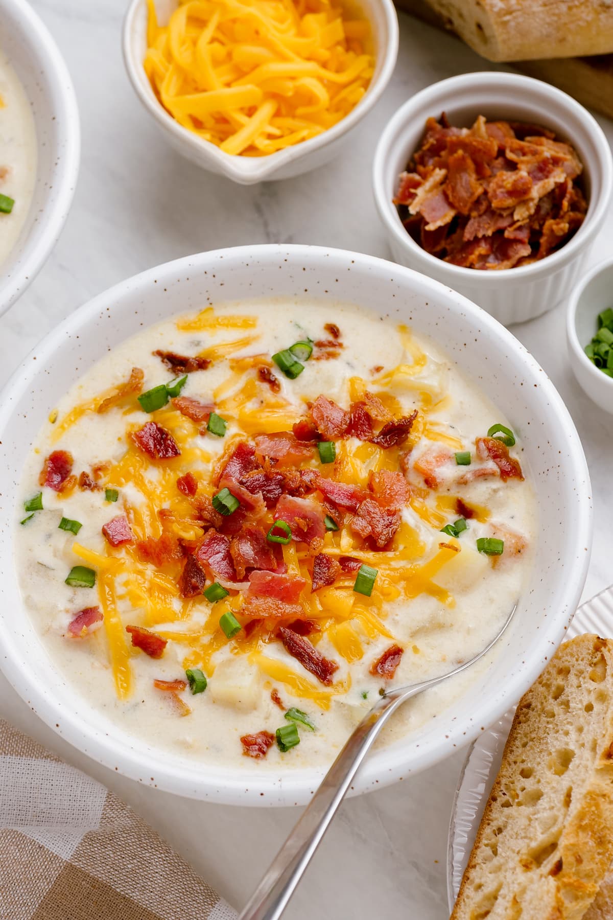 loaded-baked-potato-soup in bowls on tablescape