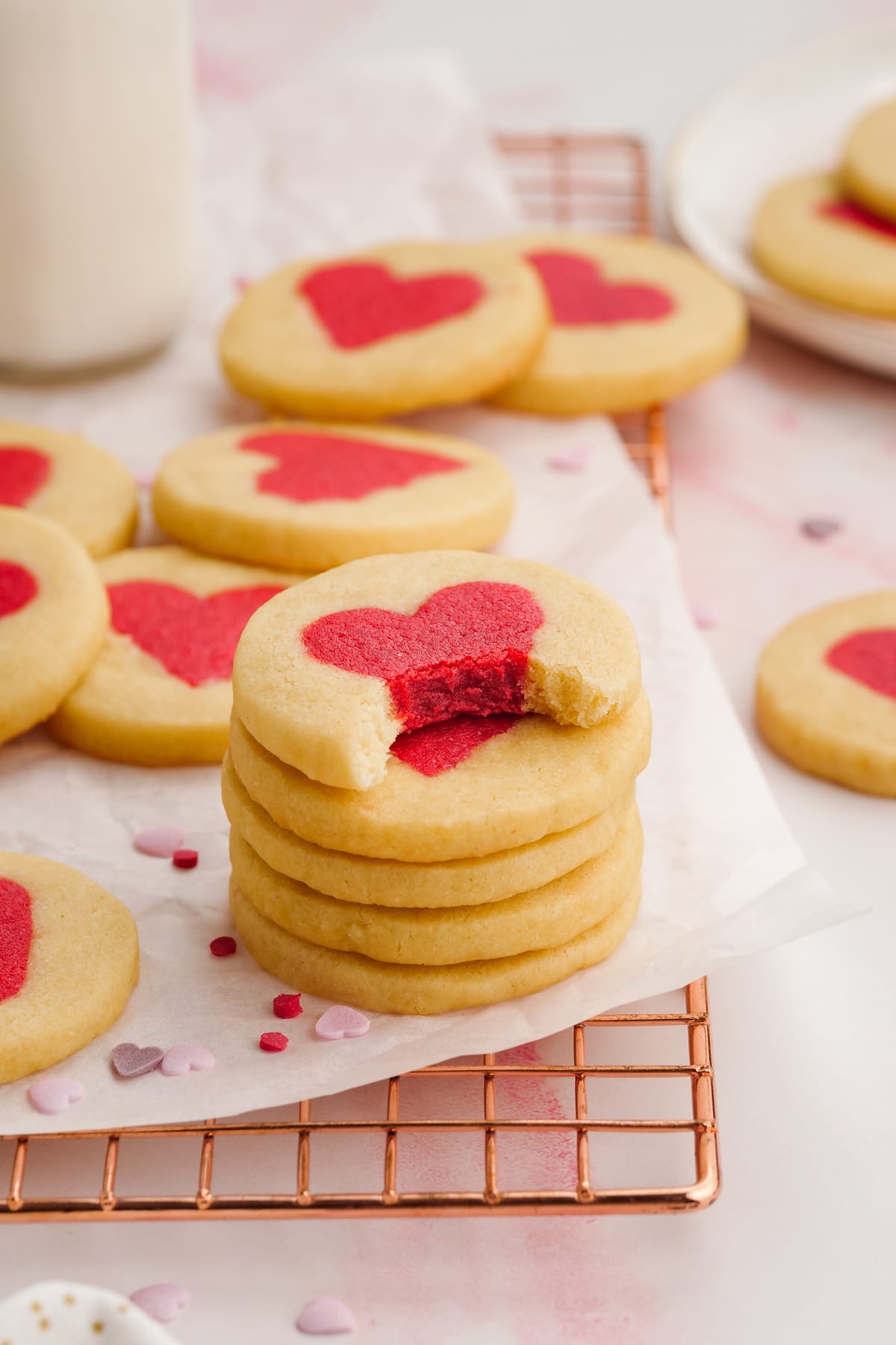 stacked valentines cookies, top cookie has a bite missing