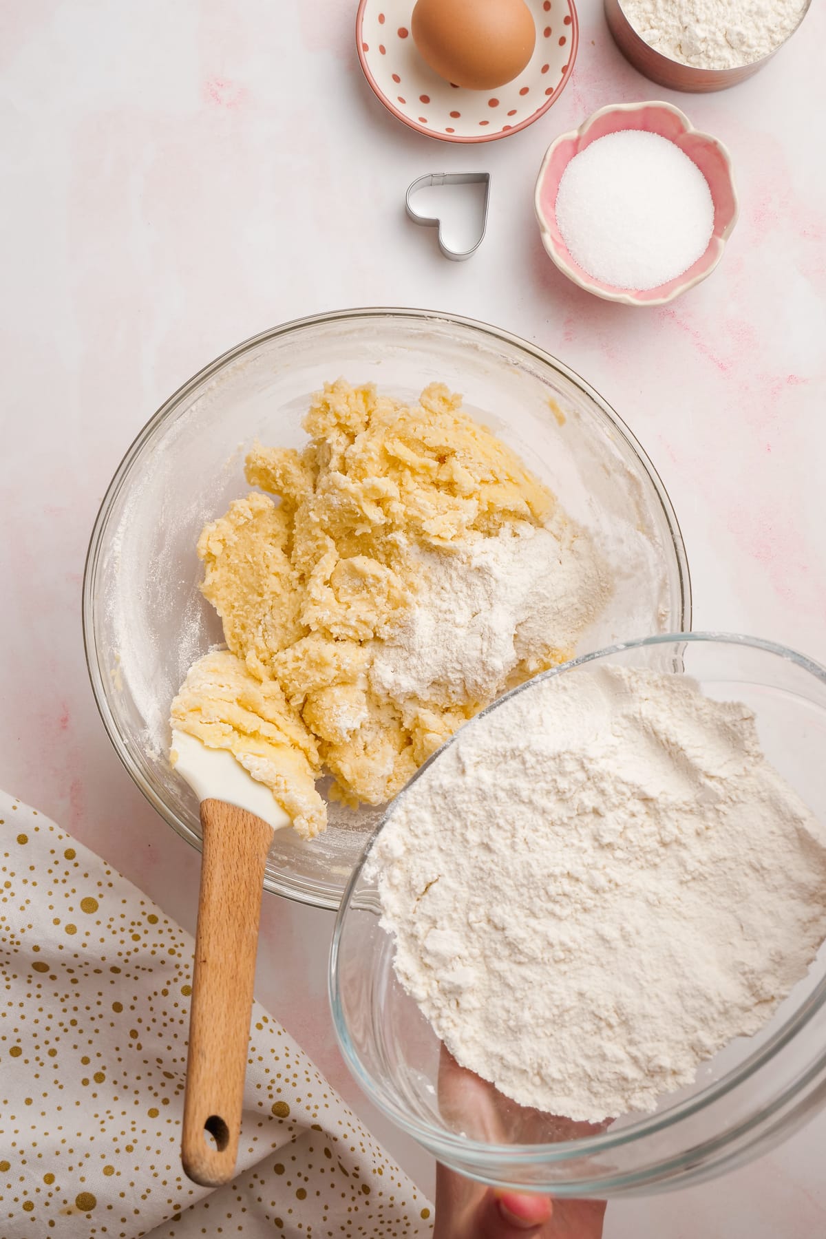 Combining dry ingredients with buttercream and sugar