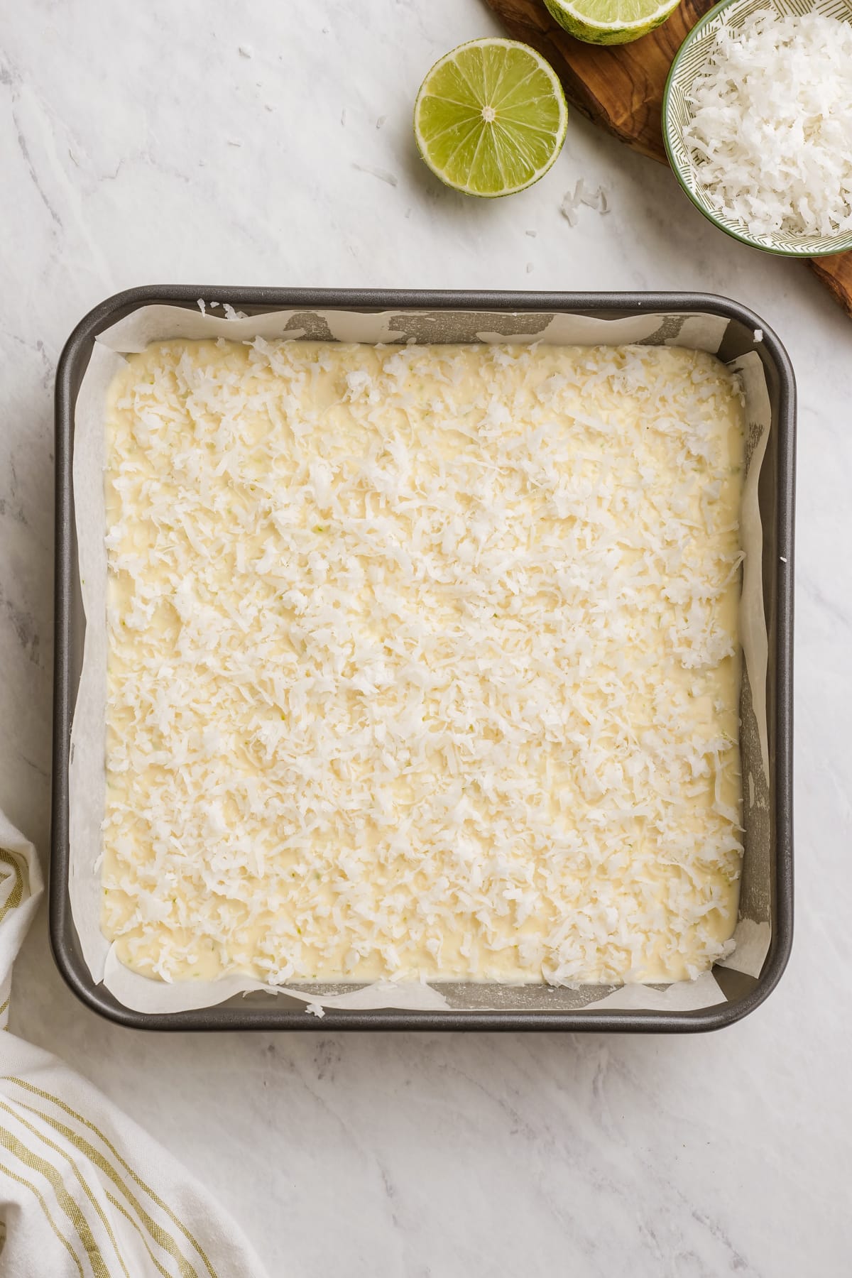 uncooked coconut bars in baking dish