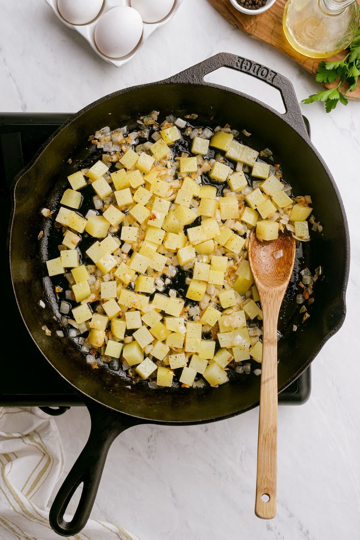 diced potatoes in cooking in a skillet