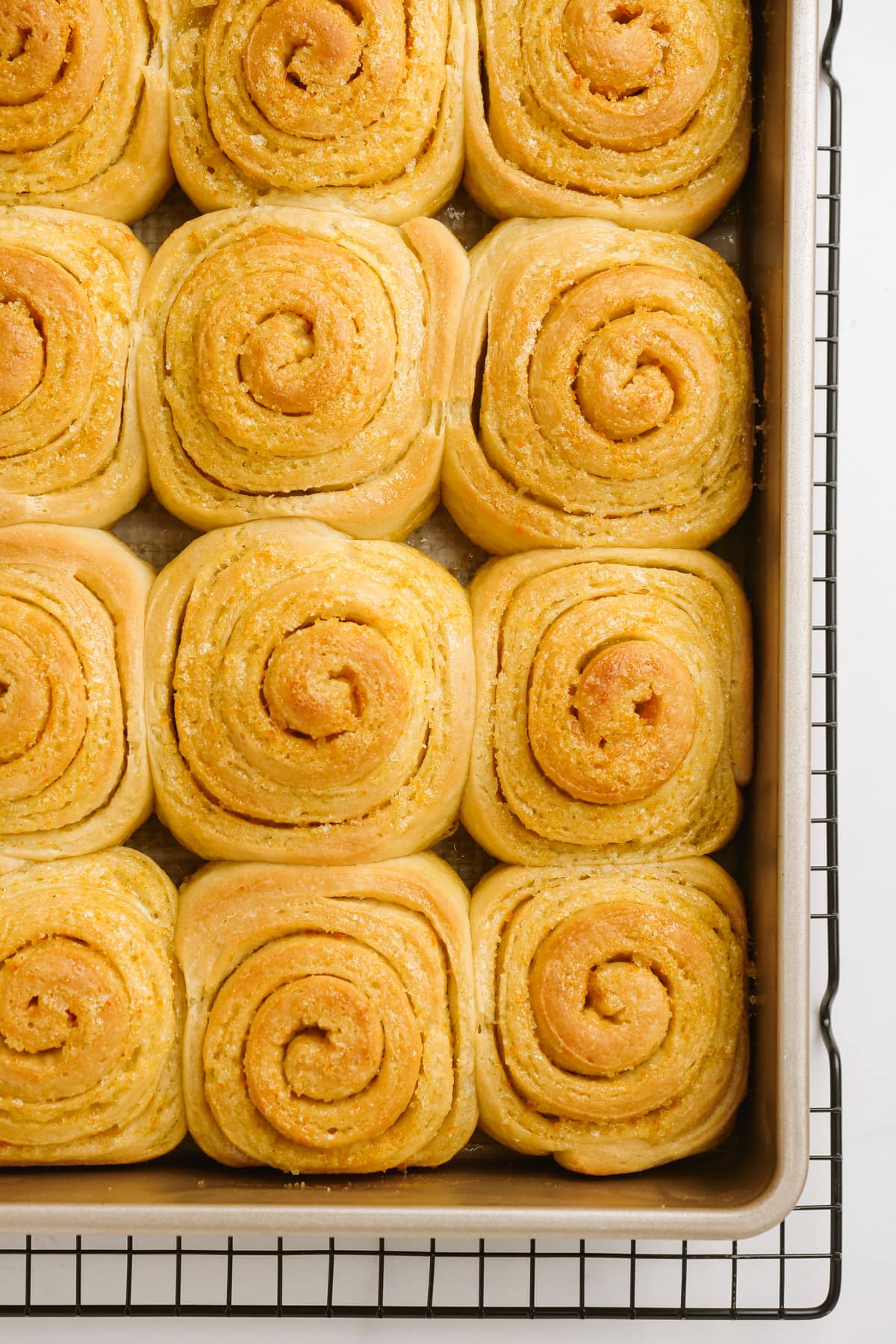 close up of baked orange rolls
