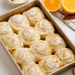 frosted orange rolls in pan