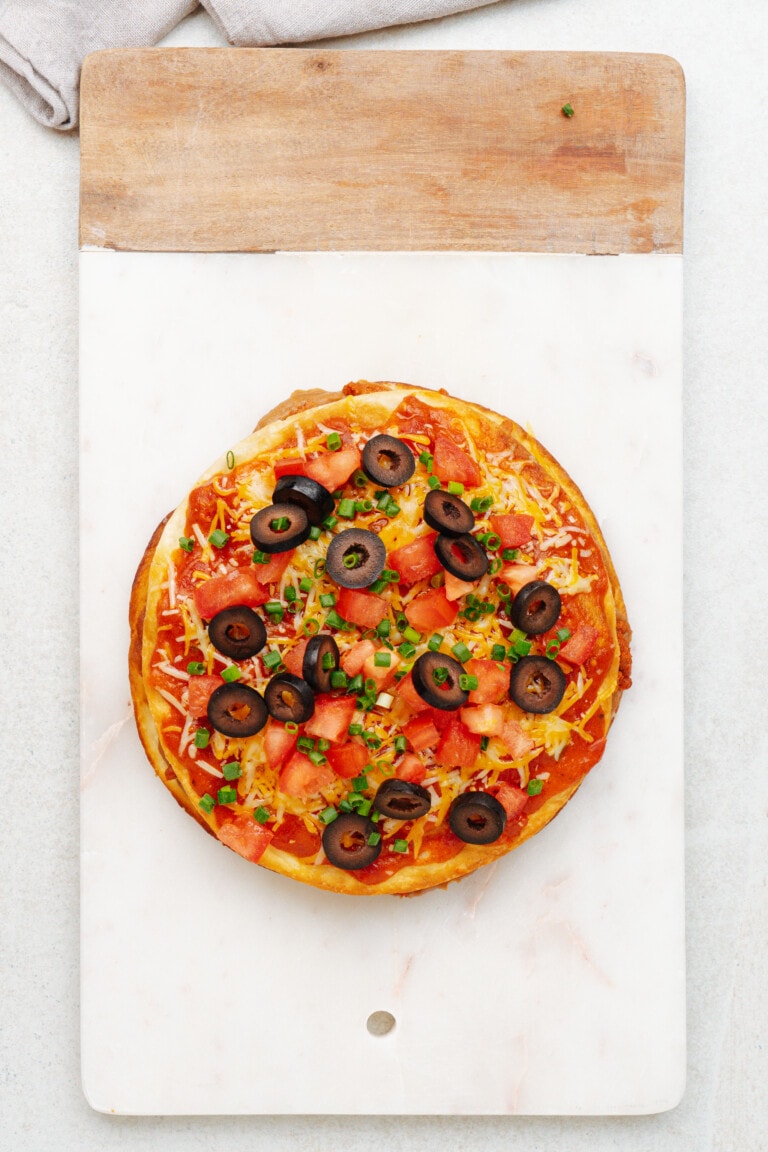 mexican pizza on cutting board