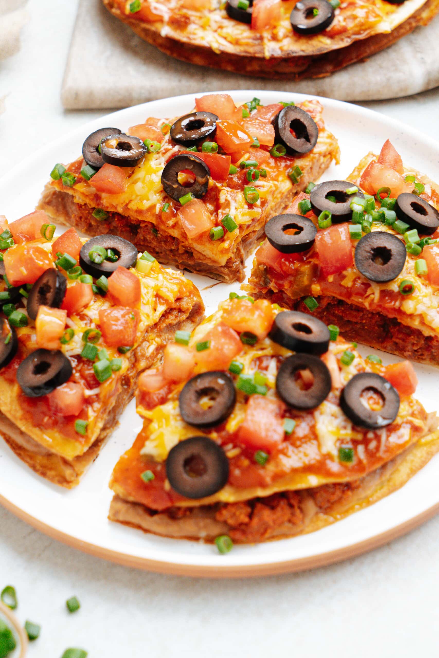 mexican pizza slices on a plate