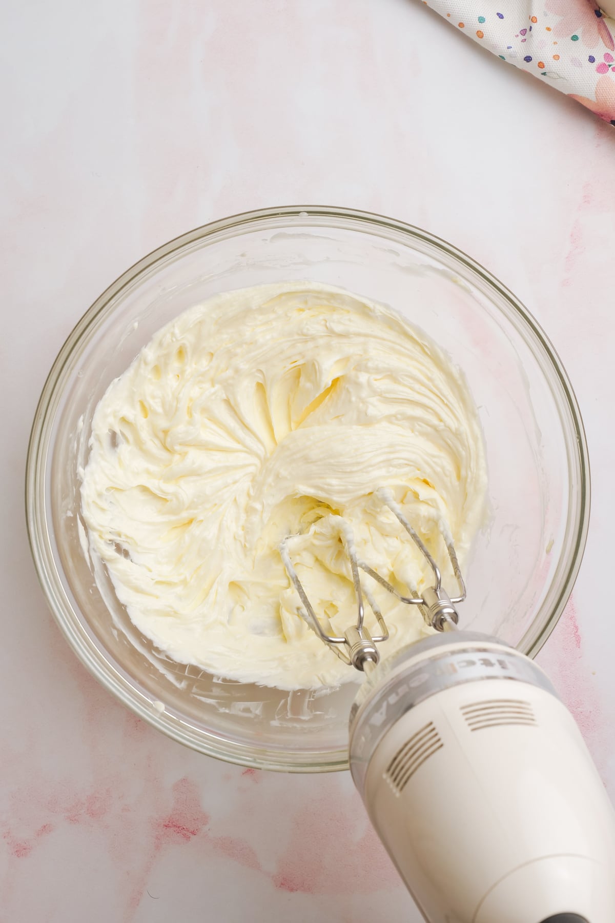 Mix frosting with hand mixer