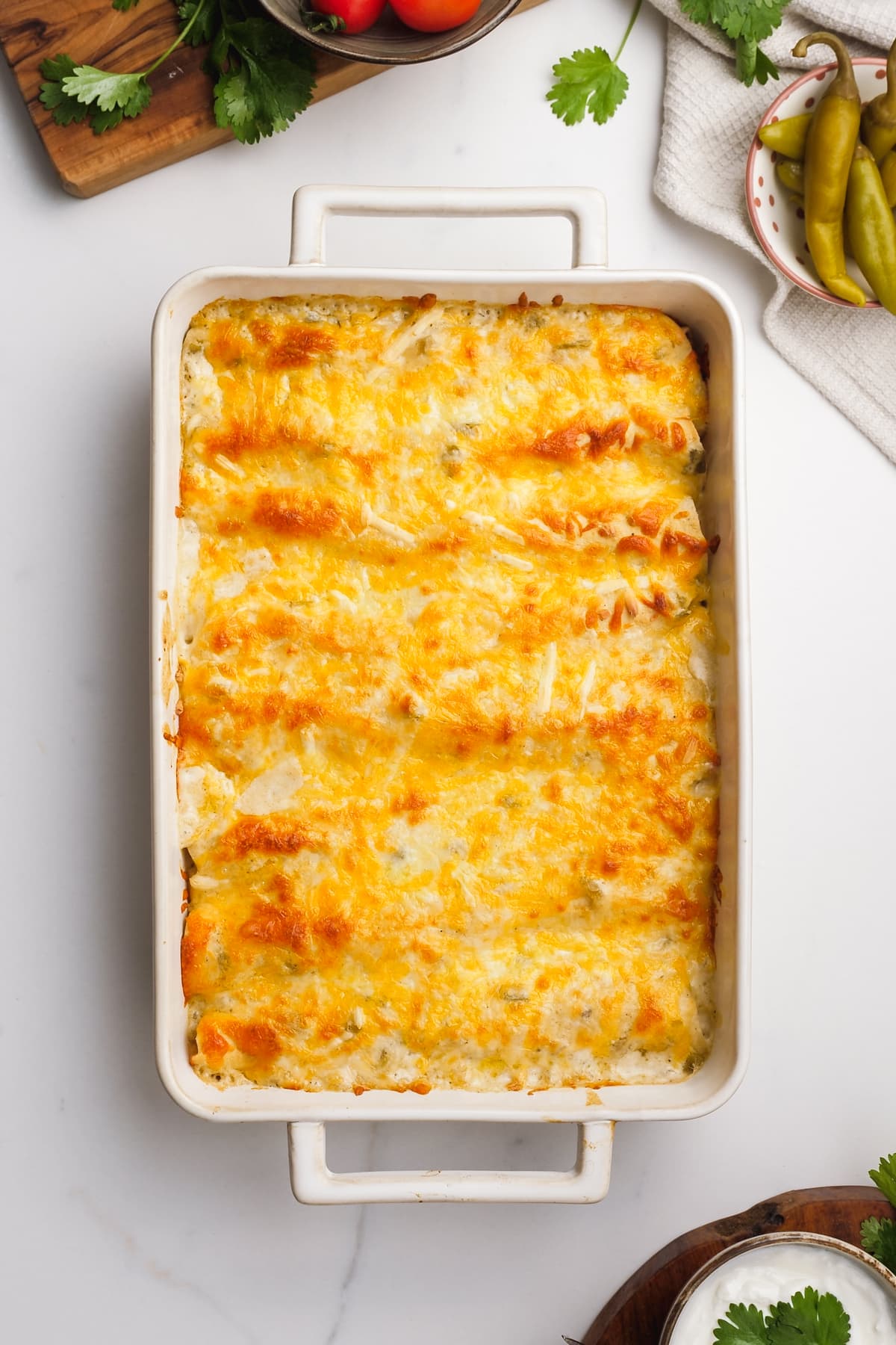 baked enchiladas with cheese melted in a pan