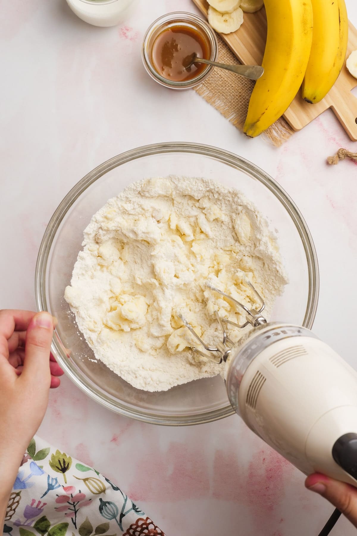 flour butter and sugar being mixed together with mixer