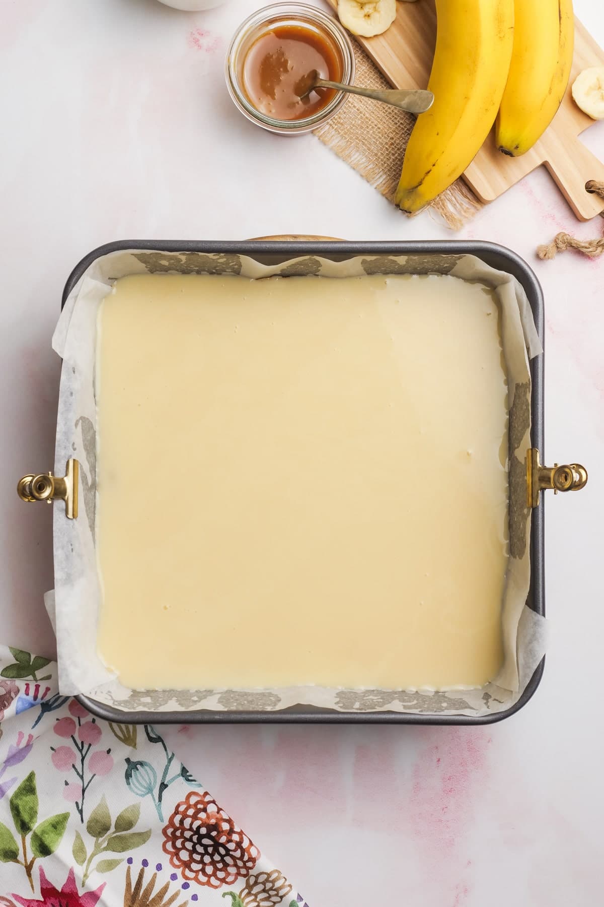 sweet and condensed milk poured over shortbread crust