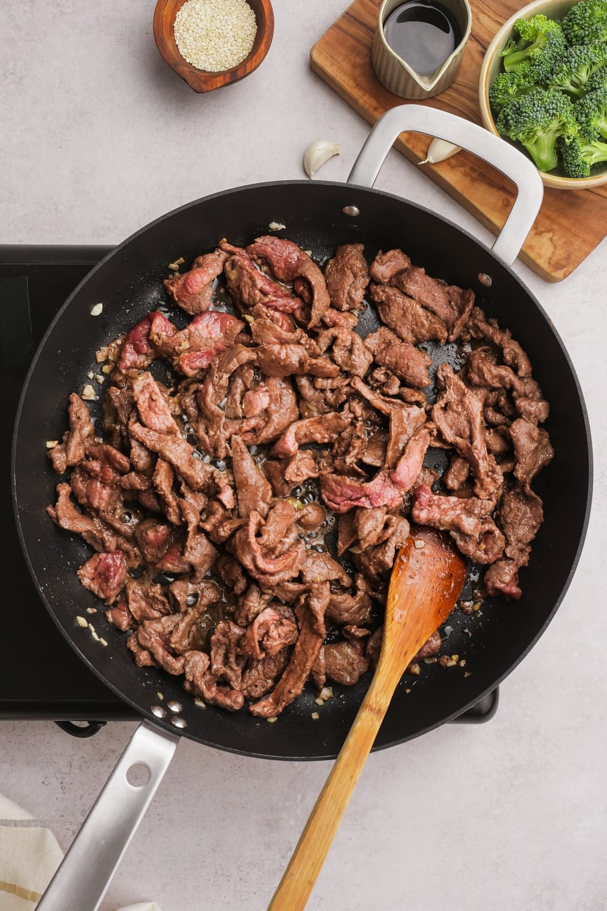 cooking beef strips in a skillet