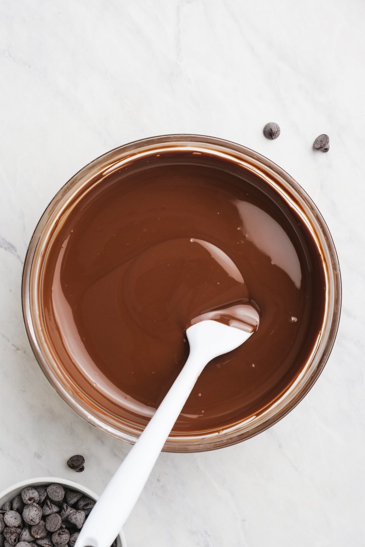 smooth melted chocolate in a bowl with rubber spatula
