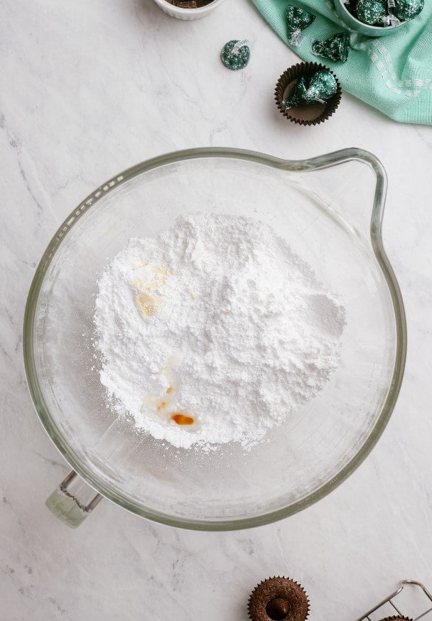 powdered sugar in a glass mixing bowl