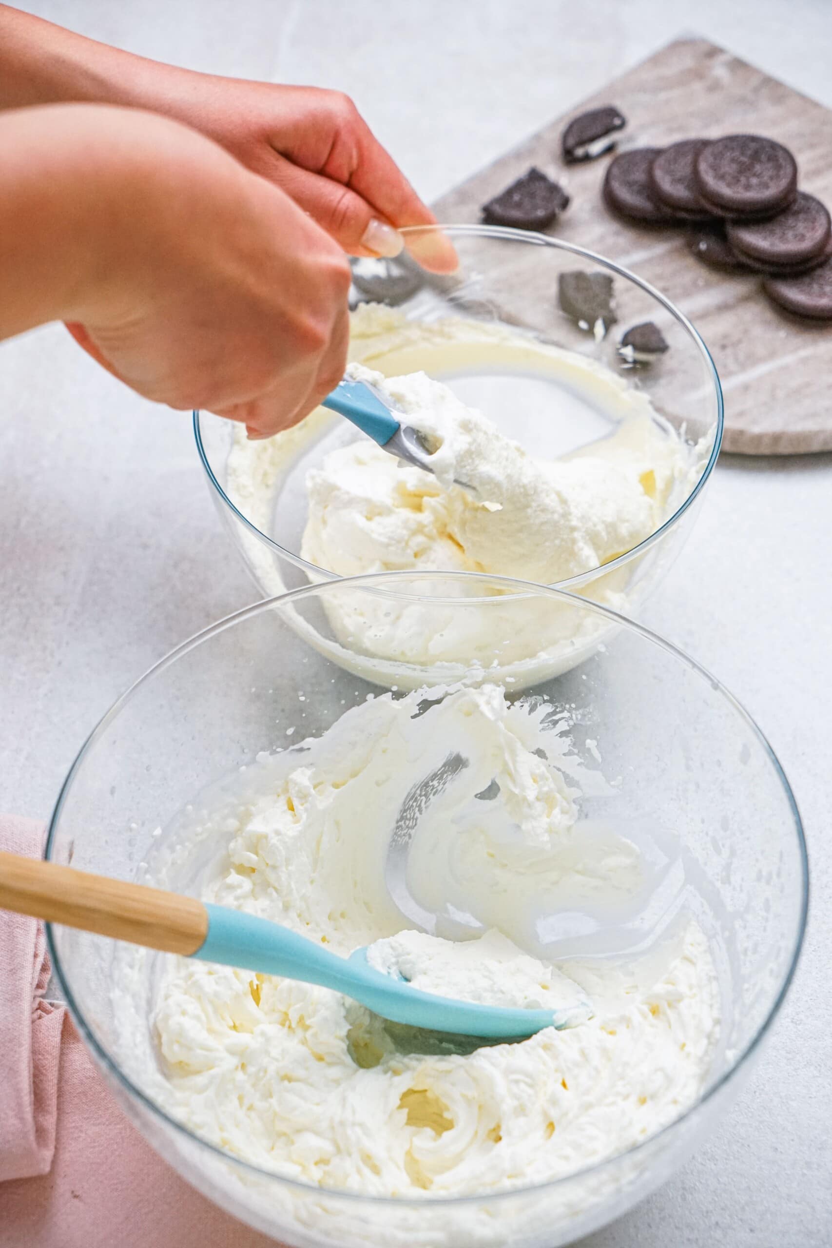 cream cheese mixture in one bowl and whipped cream in another